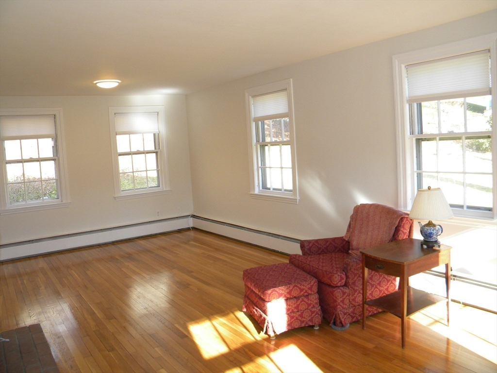 21 Lovers Lane Groton, MA 01450 - Photo 3 of 35 a living room with furniture and a window
