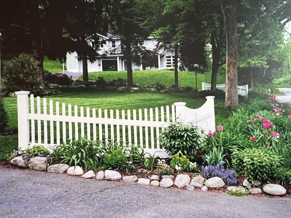 21 Lovers Lane Groton, MA 01450 - Photo 33 of 35 a garden with flowers and trees