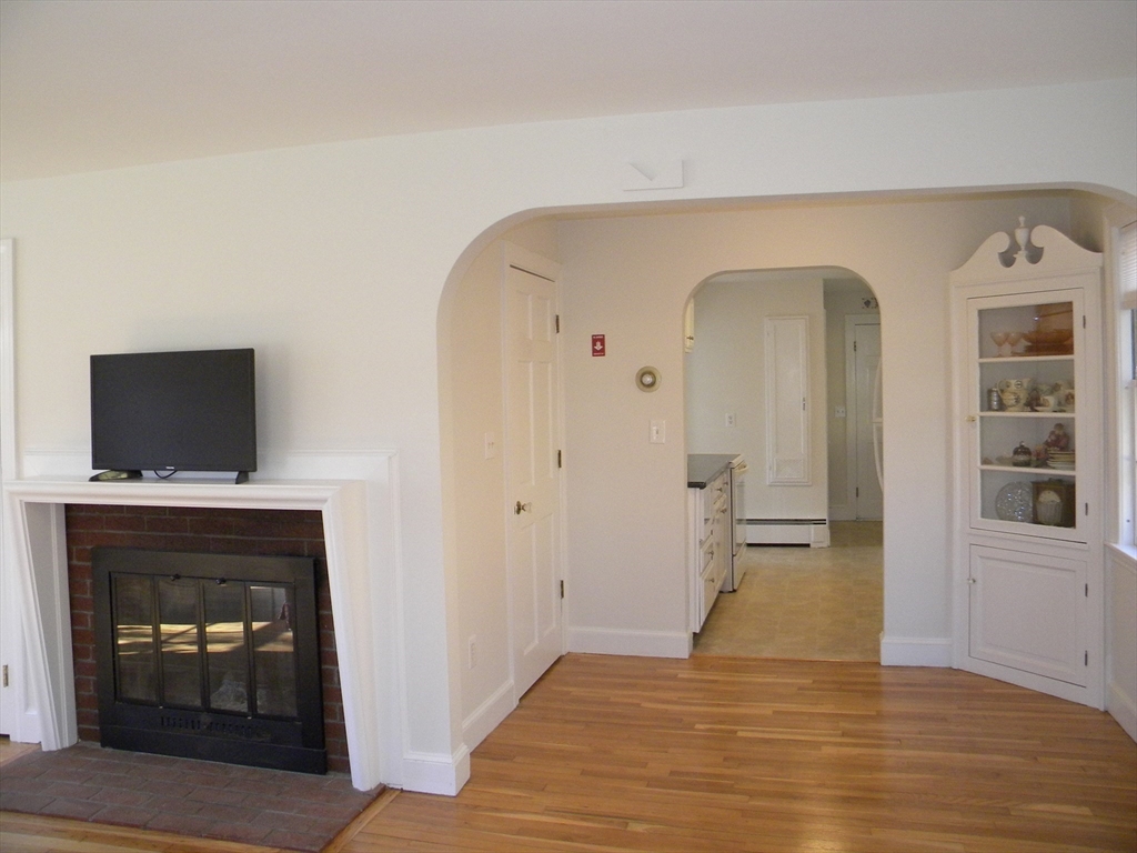 21 Lovers Lane Groton, MA 01450 - Photo 5 of 35 a view of an empty room and fire place