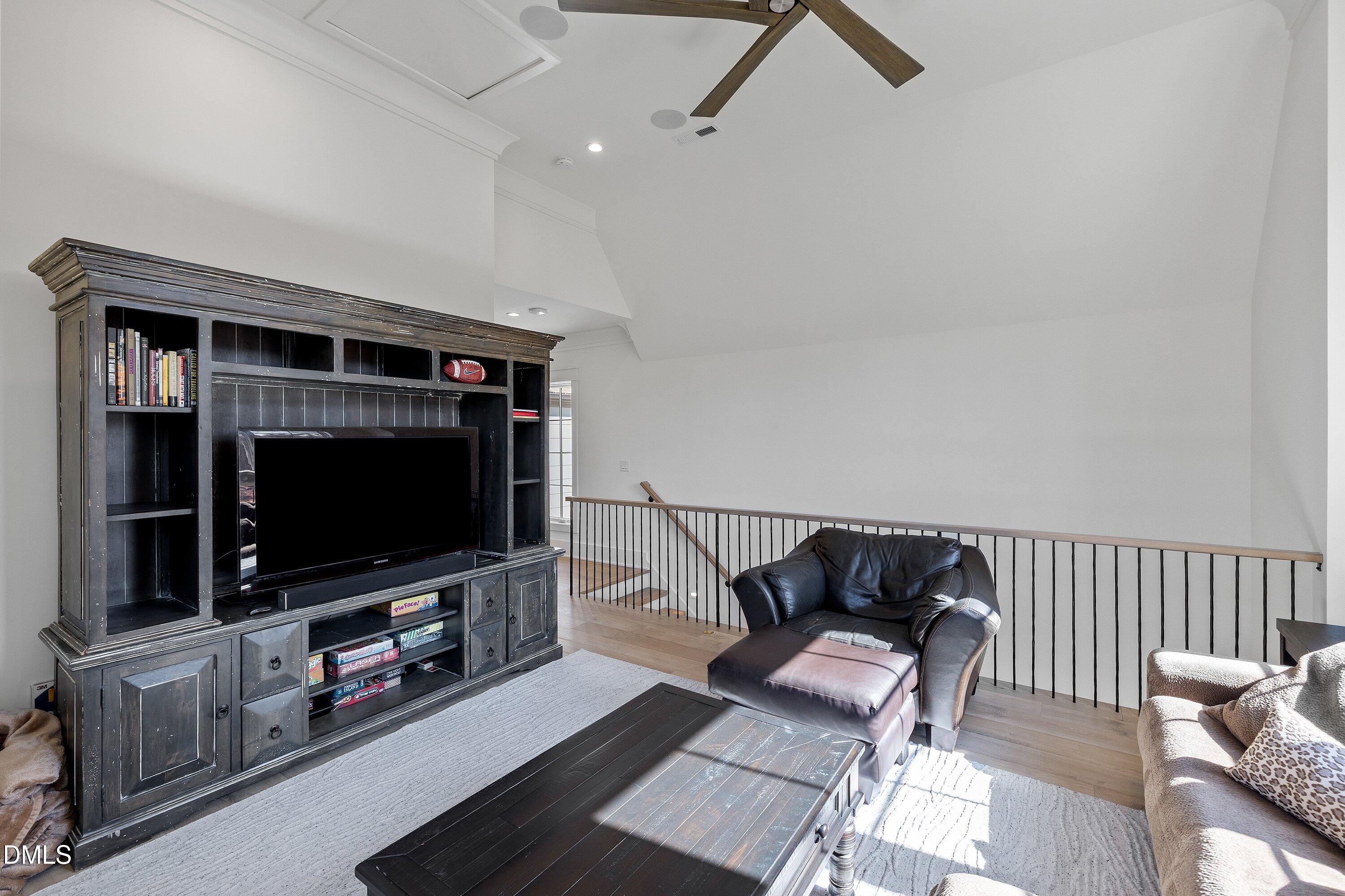 906 Brooks Avenue Raleigh, NC 27607 - Photo 52 of 64 a living room with furniture and a flat screen tv