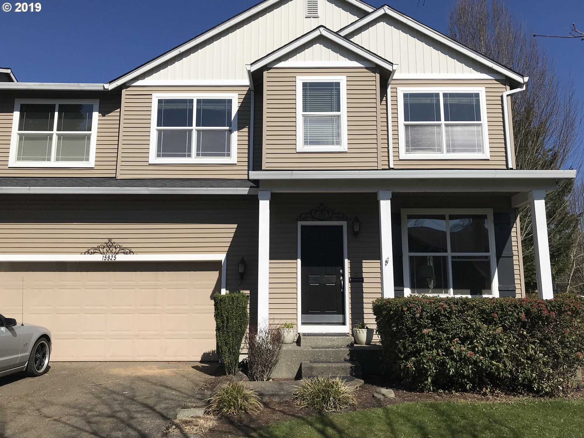 15925 Southwest Towhee Lane Beaverton, OR 97007 - Photo 1 of 1 a front view of a house with a yard