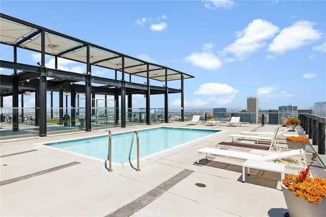 a view of a swimming pool with a lounge chairs