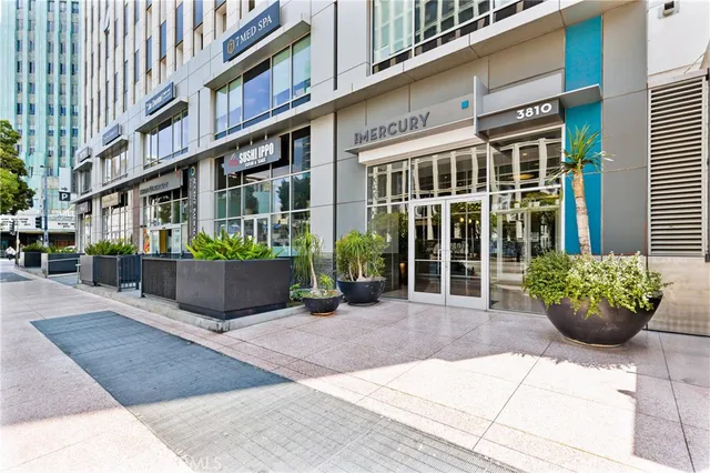 a view of a building with potted plants