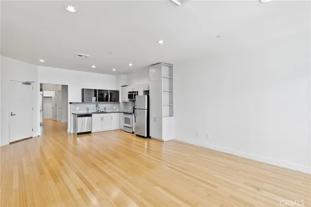 a view of kitchen with wooden floor
