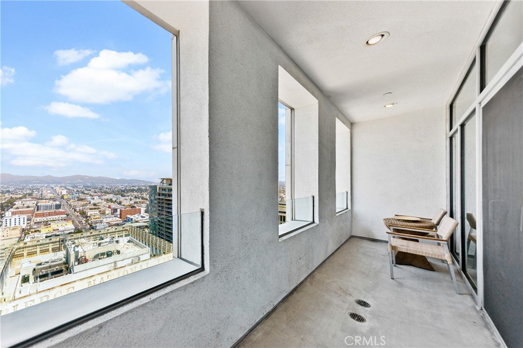 3810 Wilshire Boulevard, Unit 2002 Los Angeles, CA 90010 - Photo 6 of 25 a view of a hallway with workspace and a window