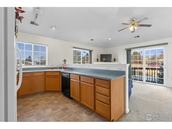 a kitchen with stainless steel appliances granite countertop a sink and cabinets