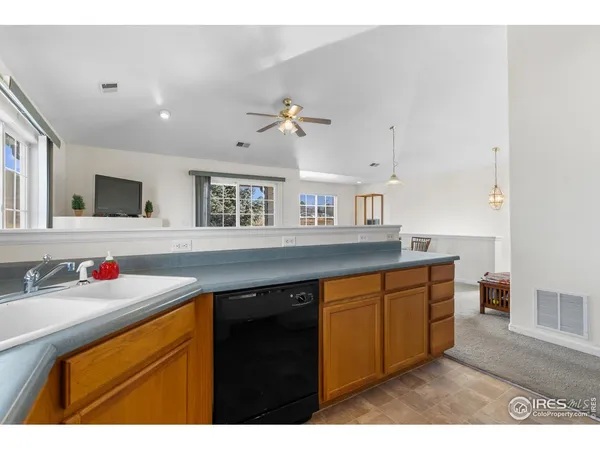 a kitchen with stainless steel appliances a sink stove and cabinets