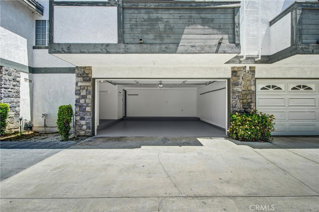 217 East Commonwealth Avenue, Unit F Alhambra, CA 91801 - Photo 22 of 25 2 Car Garage from outside