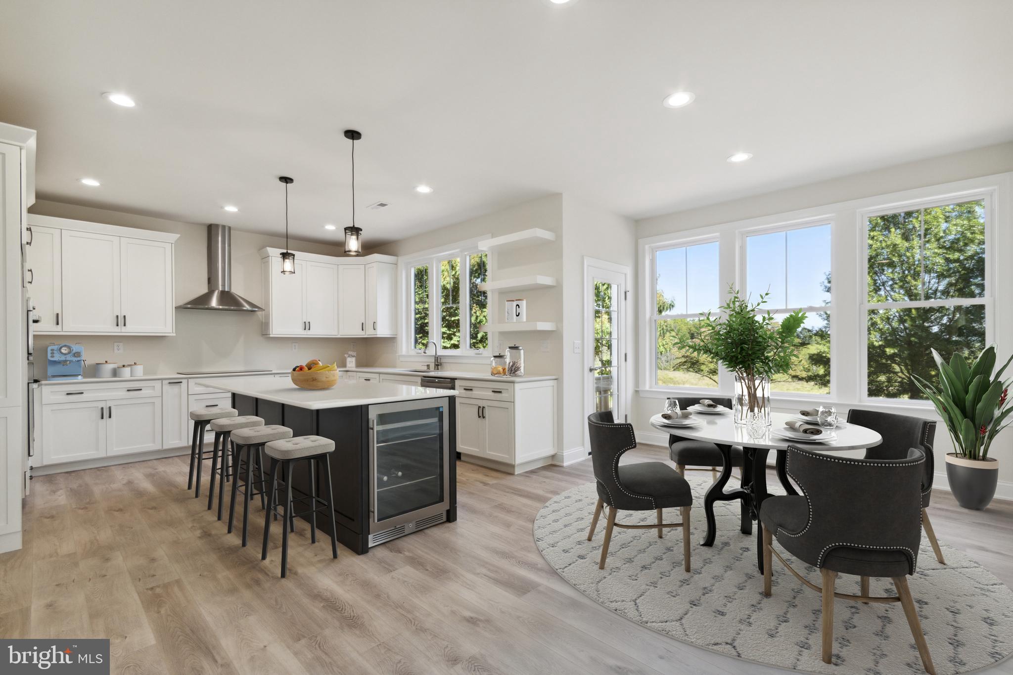 825 Morris Road Lansdale, PA 19446 - Photo 16 of 21 a kitchen with stainless steel appliances a table and chairs in it