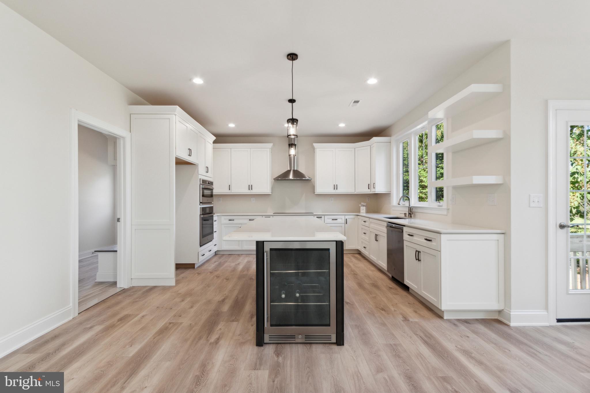 825 Morris Road Lansdale, PA 19446 - Photo 18 of 21 a kitchen with a refrigerator and a stove top oven