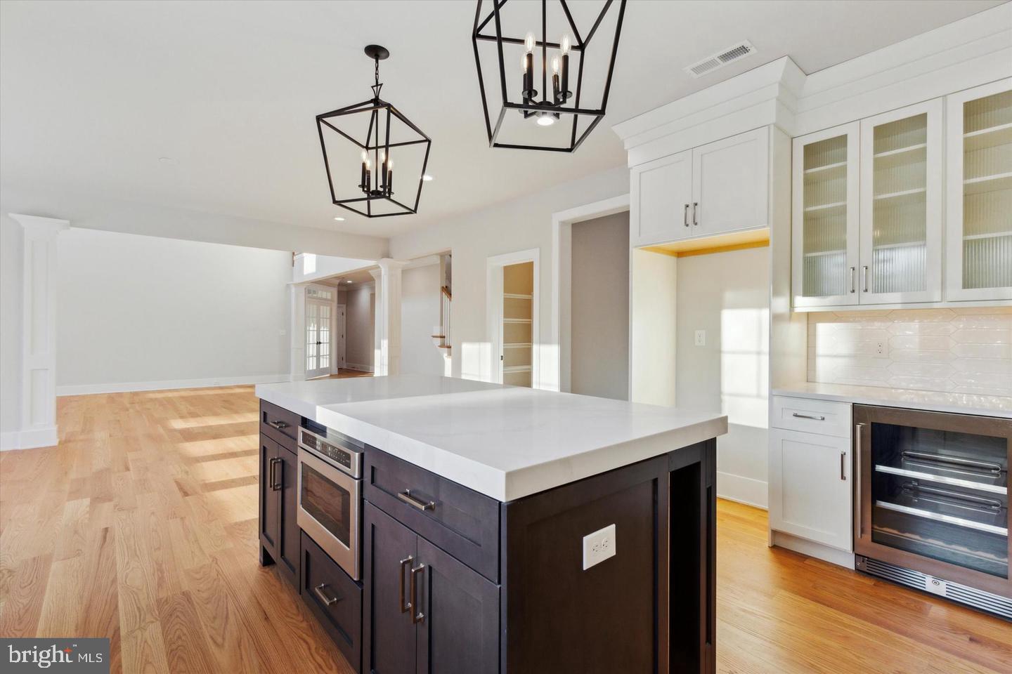 825 Morris Road Lansdale, PA 19446 - Photo 7 of 21 a kitchen with stainless steel appliances granite countertop a kitchen island a stove and a wooden floors