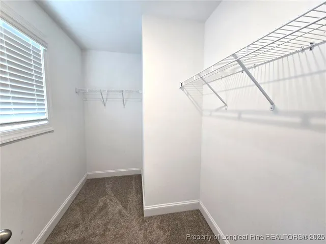 a bathroom with a double vanity sink and mirror with shower