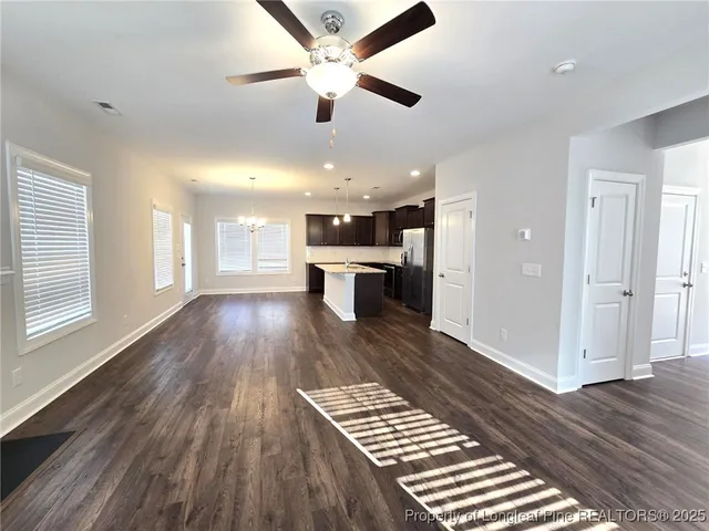 a view of kitchen with cabinets and wooden floor