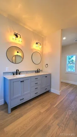 a bath tub sitting in a bathroom next to a window