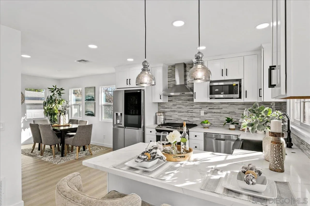 506 Brotherton Road Escondido, CA 92025 - Photo 1 of 31 a kitchen with stainless steel appliances kitchen island granite countertop a sink and cabinets
