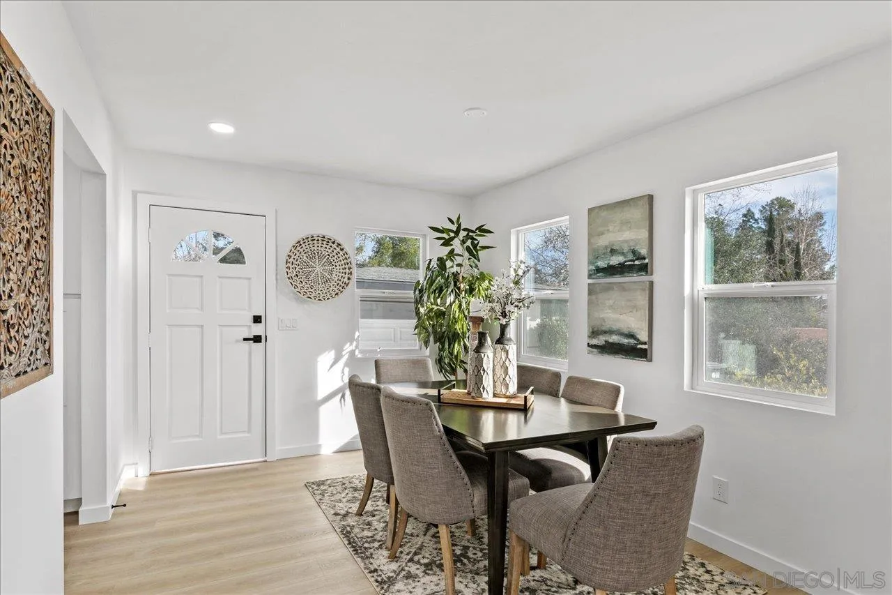 506 Brotherton Road Escondido, CA 92025 - Photo 12 of 31 a view of a dining room with furniture window and wooden floor