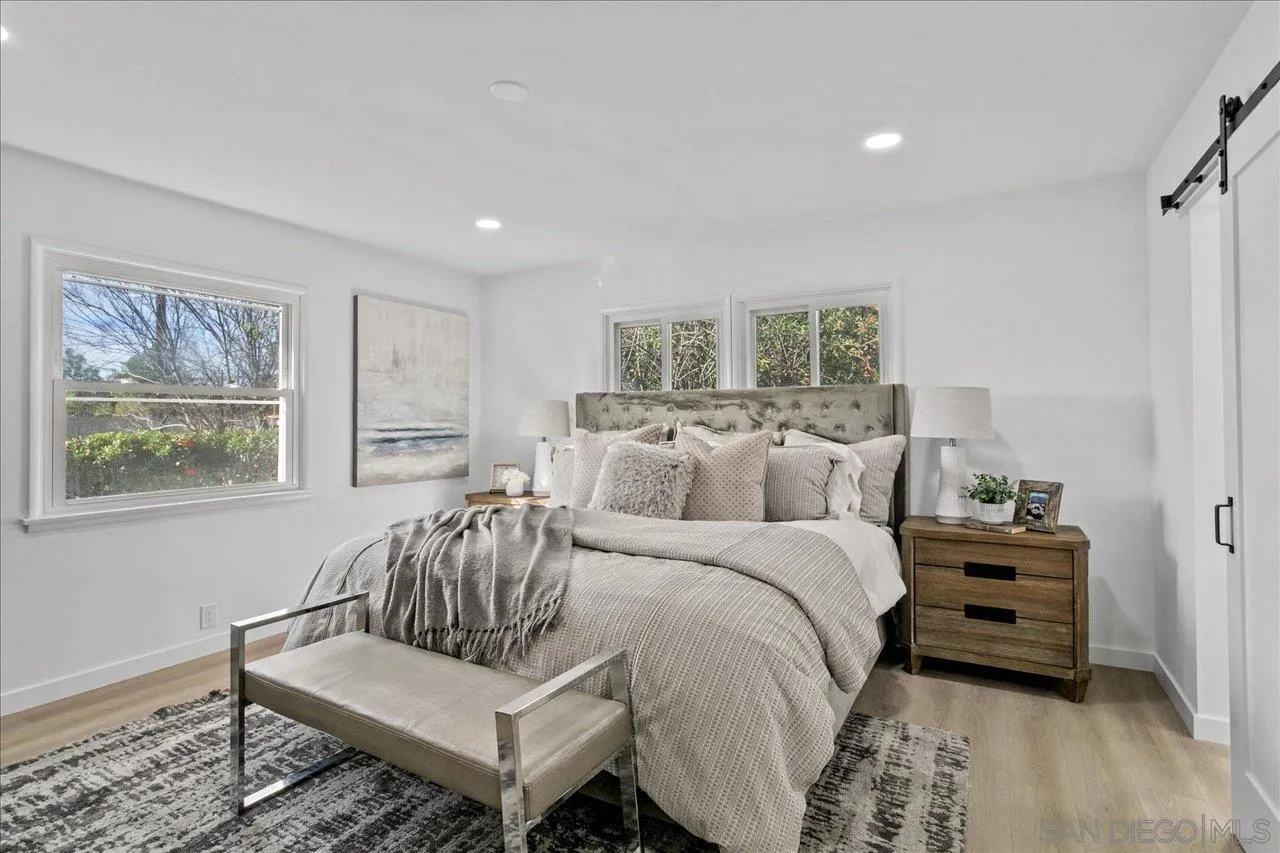 506 Brotherton Road Escondido, CA 92025 - Photo 13 of 31 a spacious bedroom with a bed and a couch