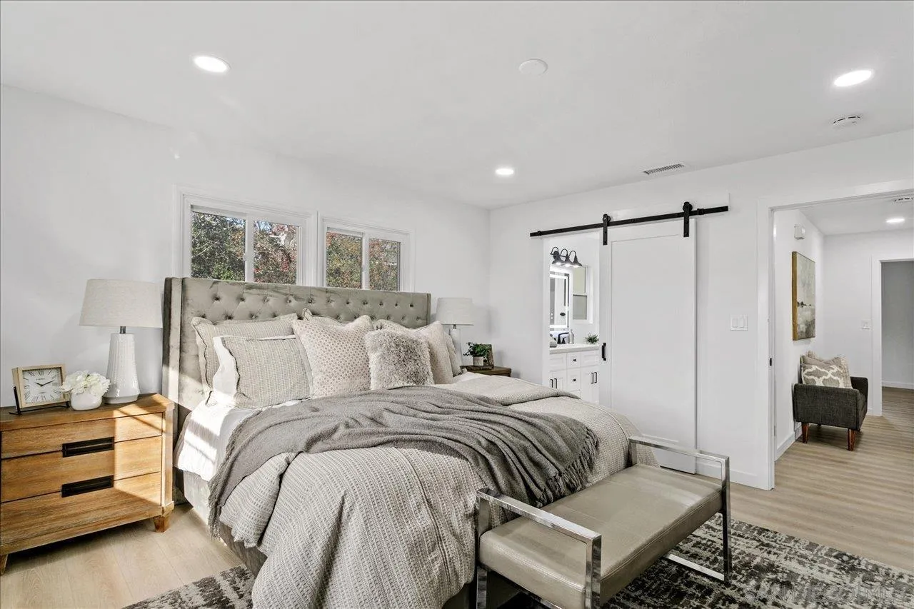 506 Brotherton Road Escondido, CA 92025 - Photo 15 of 31 a bedroom with a bed and a table