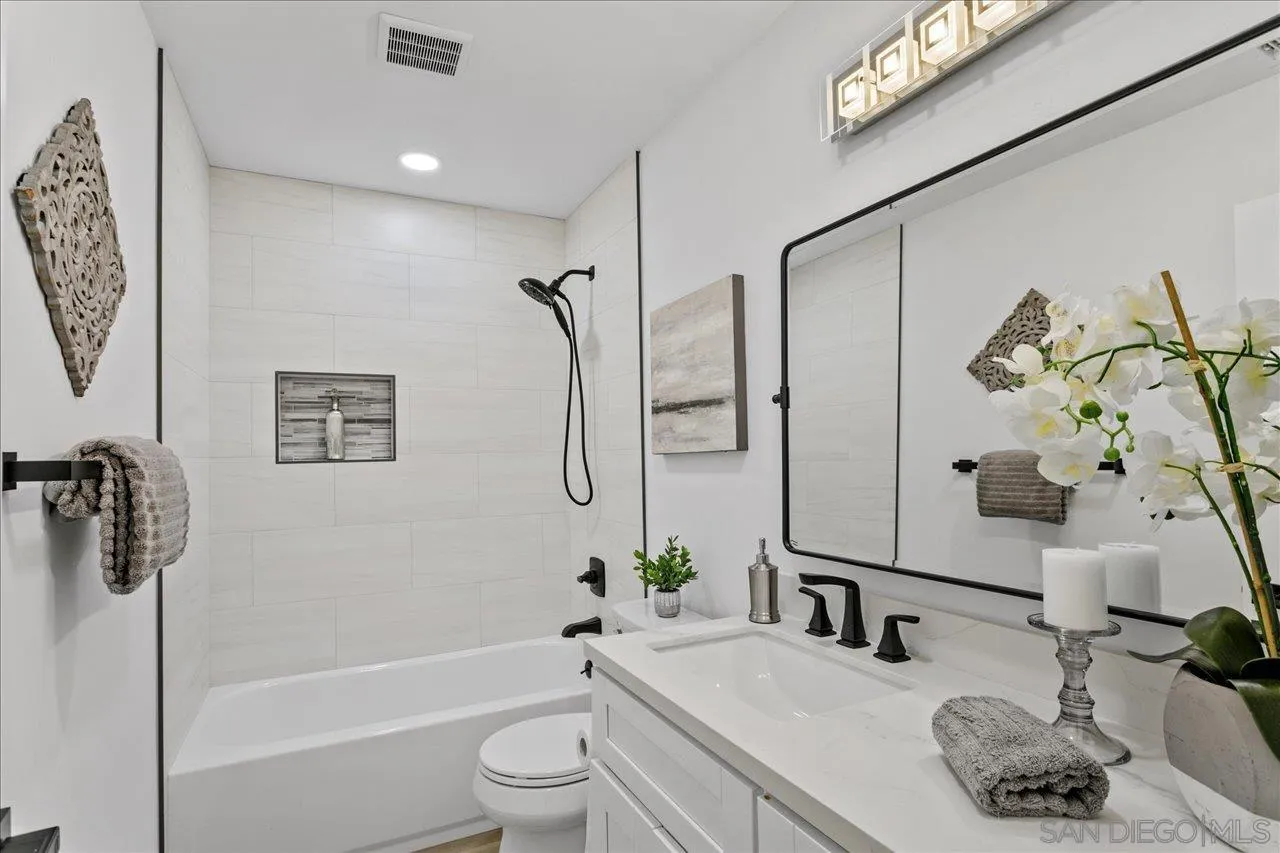 506 Brotherton Road Escondido, CA 92025 - Photo 18 of 31 a bathroom with a granite countertop sink a toilet and shower