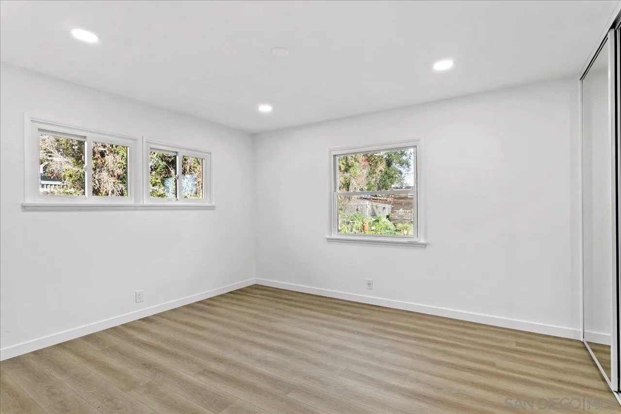 506 Brotherton Road Escondido, CA 92025 - Photo 23 of 31 a view of room with window and hardwood floor