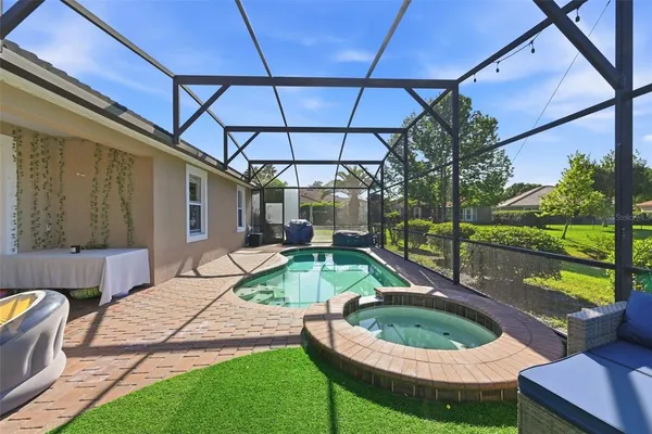 a view of a swimming pool with a yard