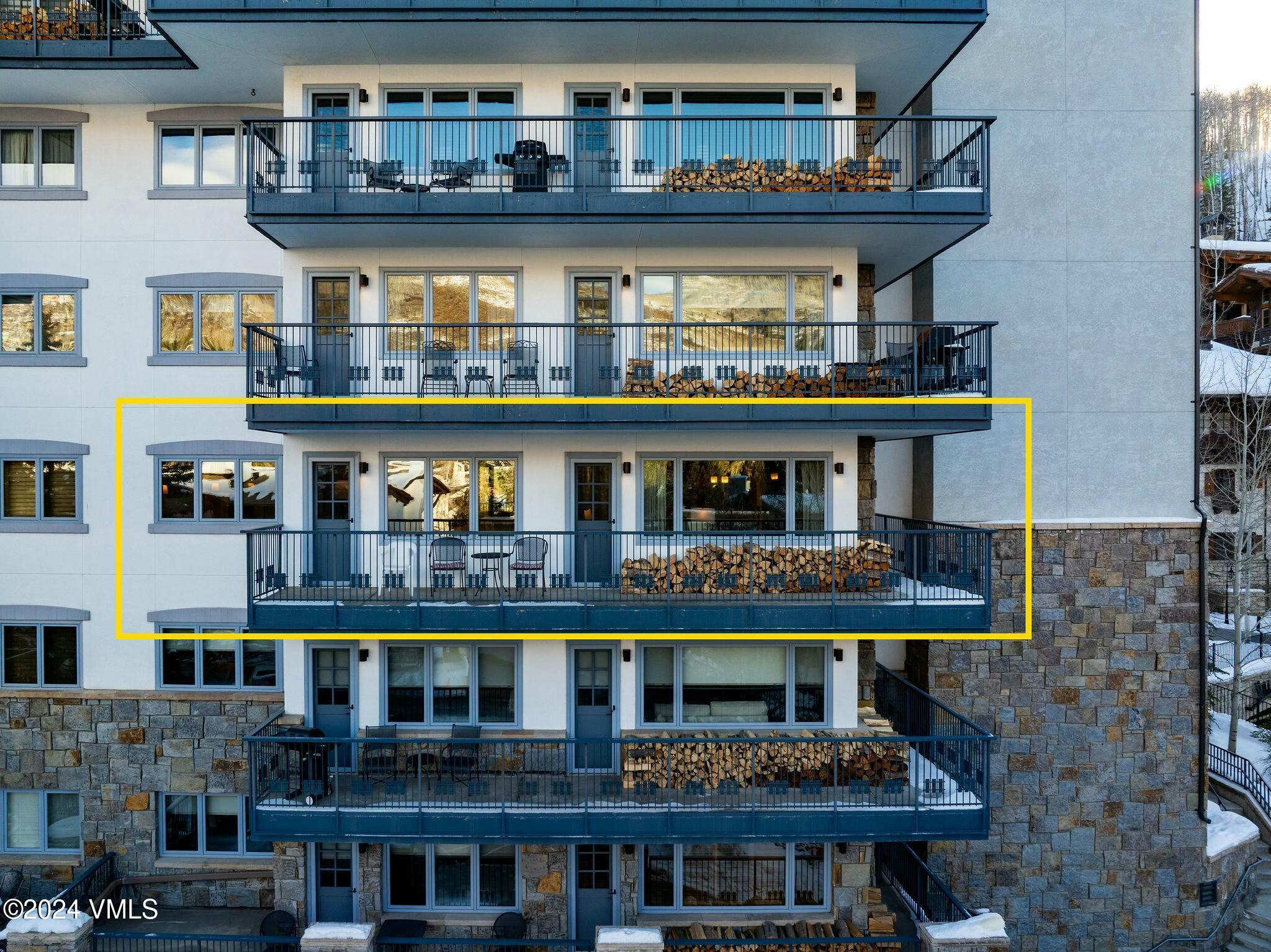 200 Vail Road, Unit 394 Vail, CO 81657 - Photo 4 of 16 a front view of multi story residential apartment building with yard and outdoor seating