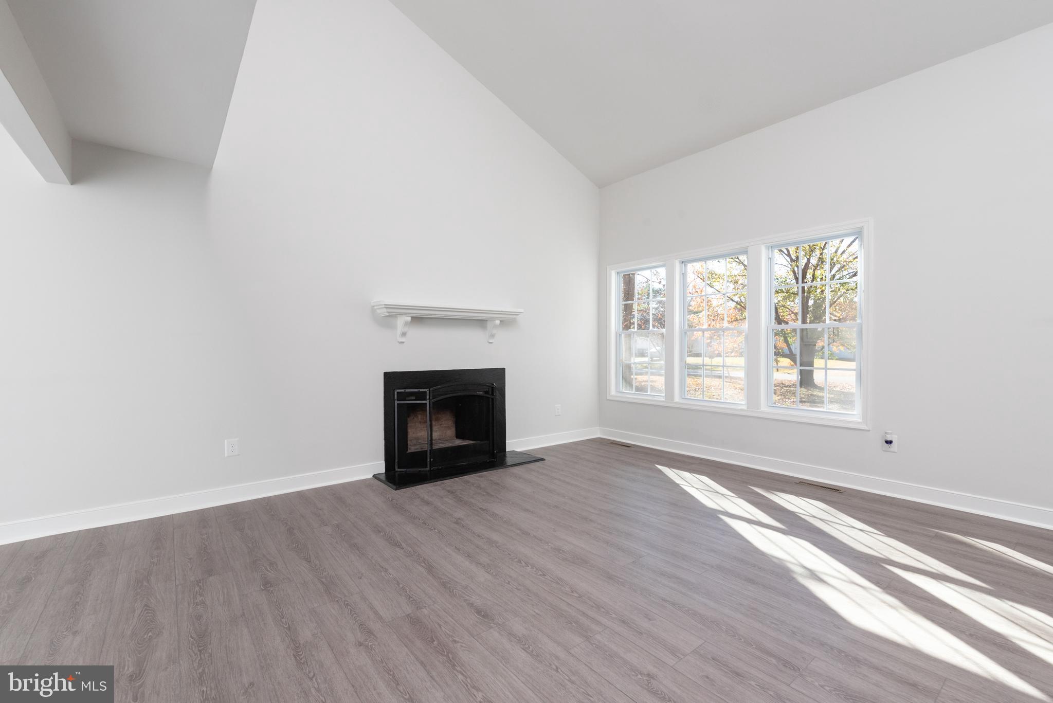 1709 Headwaters Road Midlothian, VA 23113 - Photo 12 of 42 an empty room with windows and fireplace