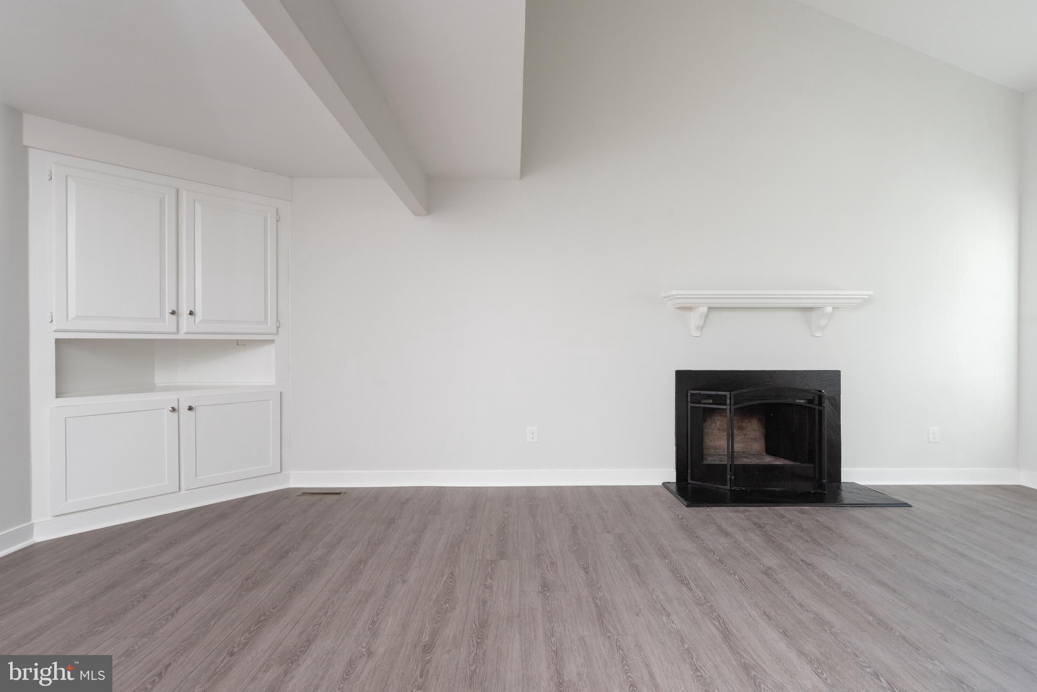 1709 Headwaters Road Midlothian, VA 23113 - Photo 13 of 42 a view of empty room with wooden floor and fireplace