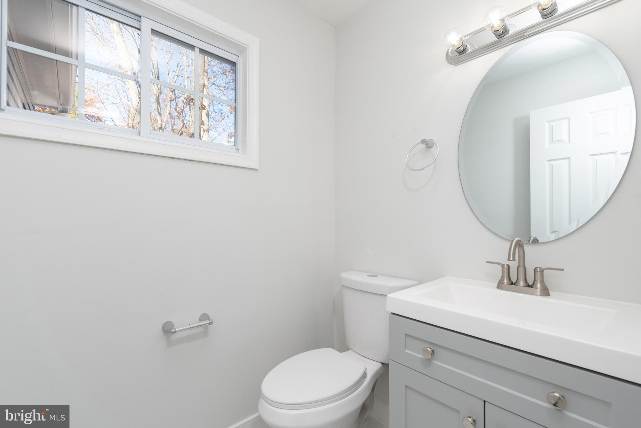 1709 Headwaters Road Midlothian, VA 23113 - Photo 16 of 42 a bathroom with a toilet a sink and mirror