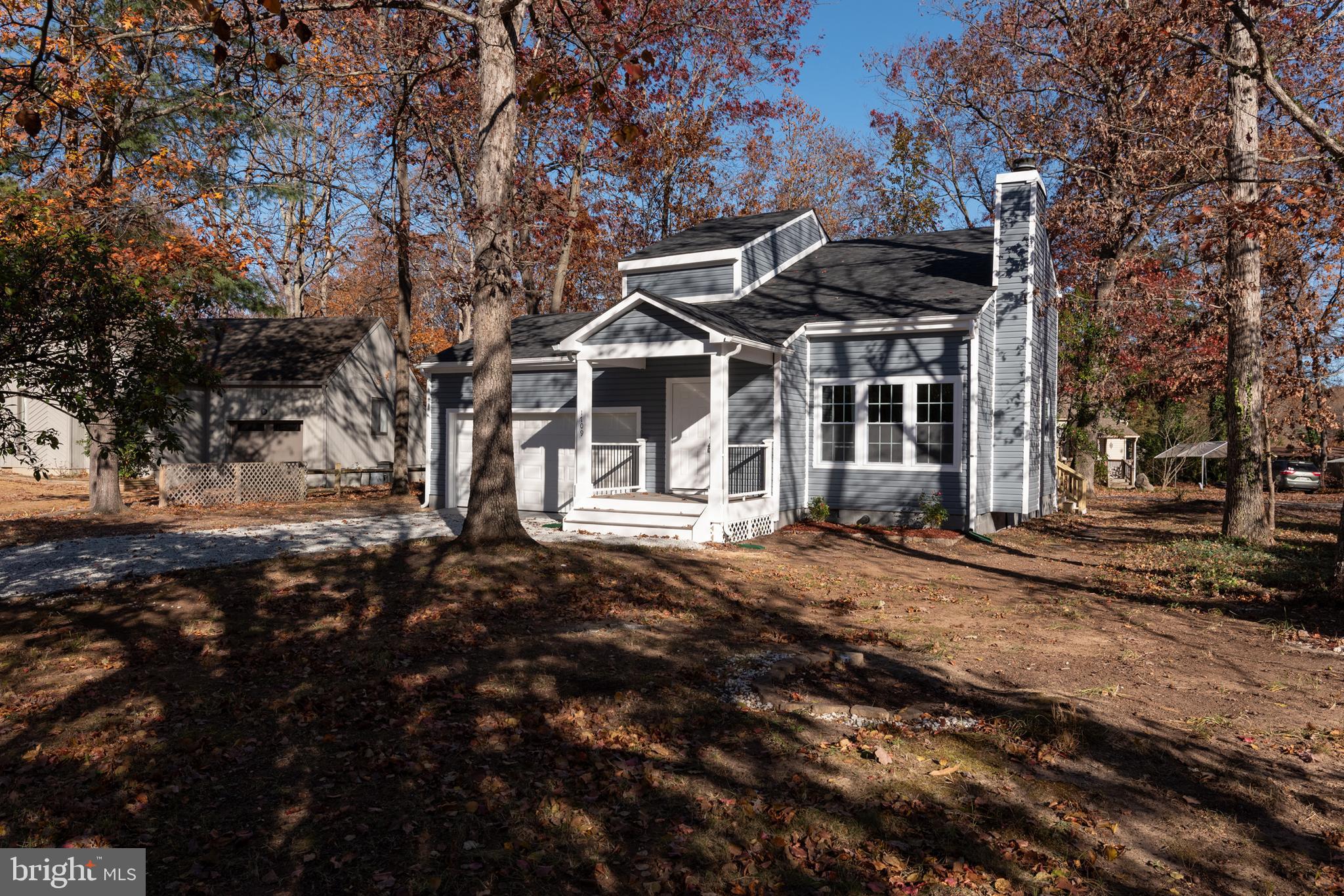 1709 Headwaters Road Midlothian, VA 23113 - Photo 3 of 42 a view of a white house with a large tree