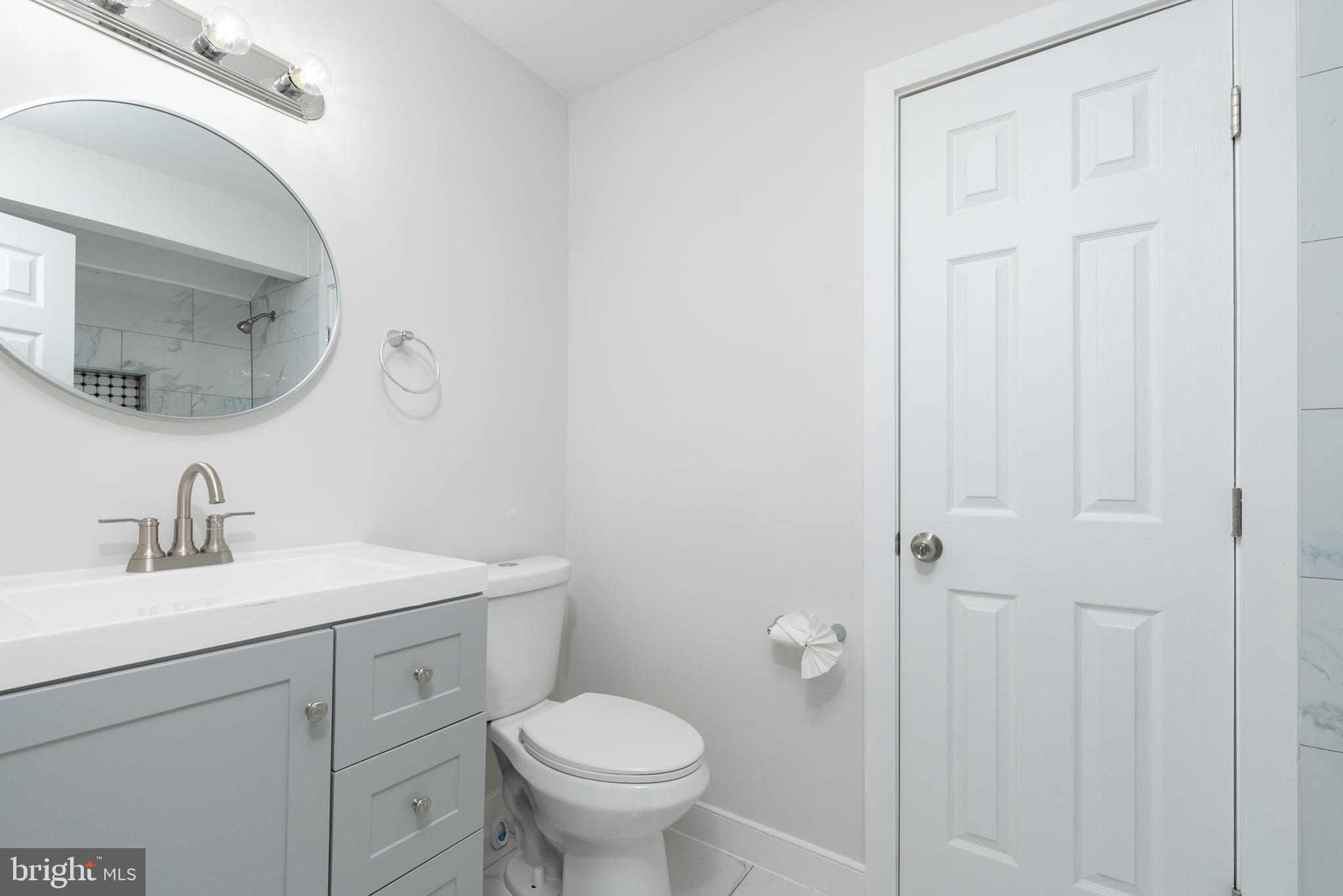 1709 Headwaters Road Midlothian, VA 23113 - Photo 31 of 42 a bathroom with a toilet sink and mirror