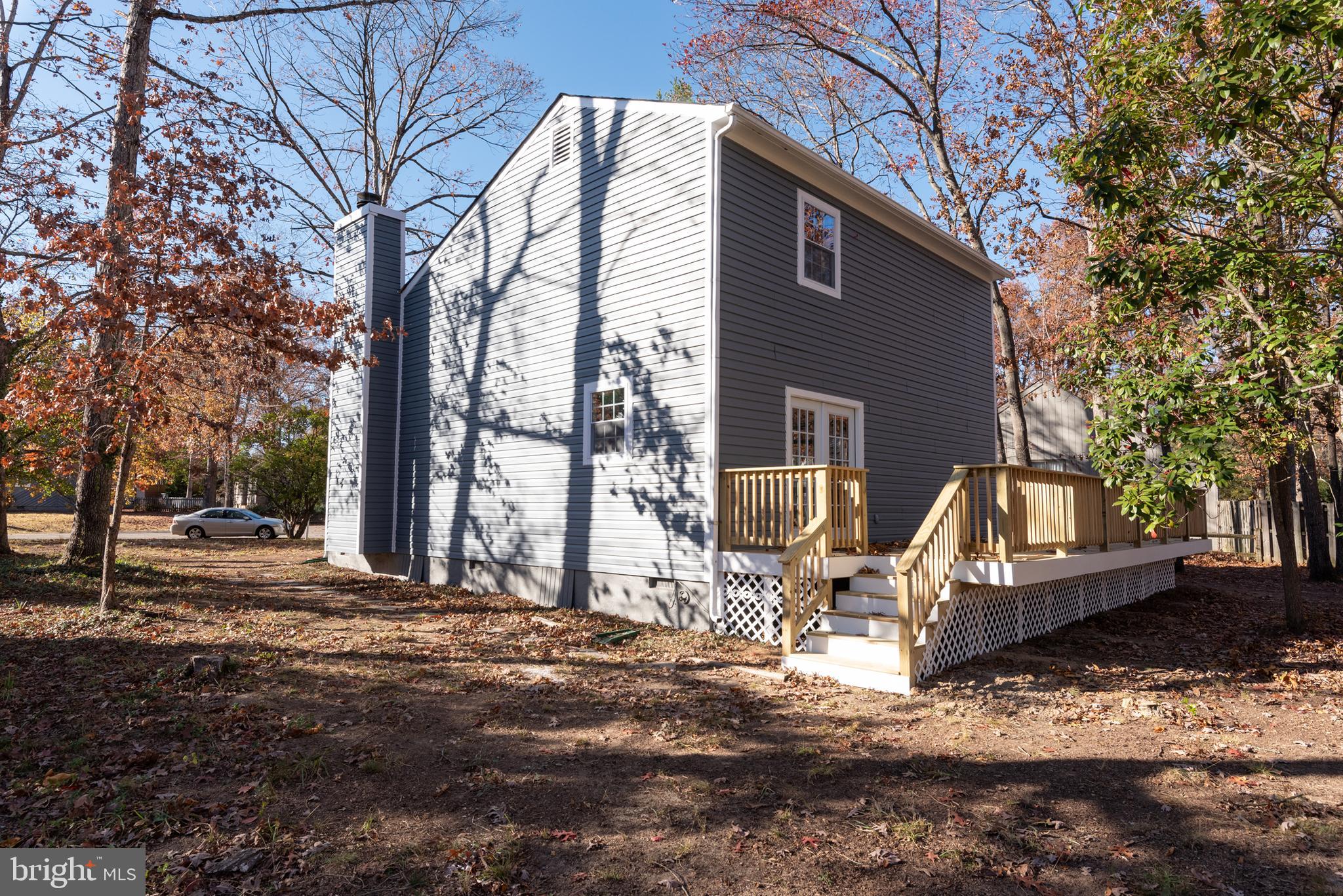 1709 Headwaters Road Midlothian, VA 23113 - Photo 34 of 42 a front view of a house with a yard covered with snow