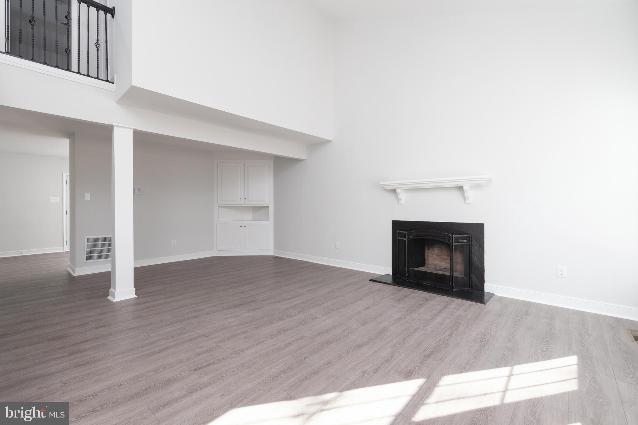 1709 Headwaters Road Midlothian, VA 23113 - Photo 9 of 42 a view of empty room with wooden floor and fireplace