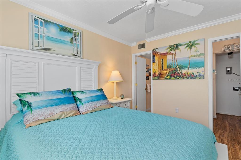 25275 Rampart Boulevard, Unit 202 Punta Gorda, FL 33983 - Photo 14 of 28 a bedroom with a bed and a dresser