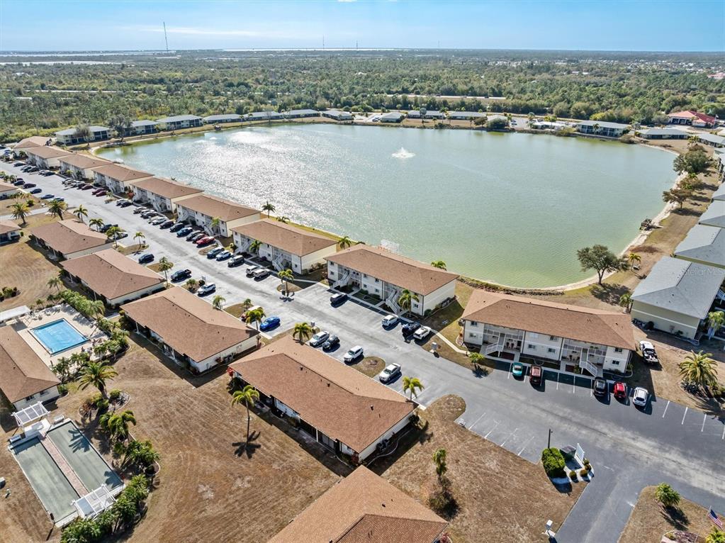 25275 Rampart Boulevard, Unit 202 Punta Gorda, FL 33983 - Photo 24 of 28 an aerial view of a city with ocean view