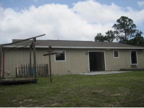 120 Southwest Ware Palm Bay, FL 32908 - Photo 6 of 11 front view of house with a yard
