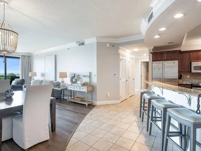 a living room with kitchen island furniture and a wooden floor