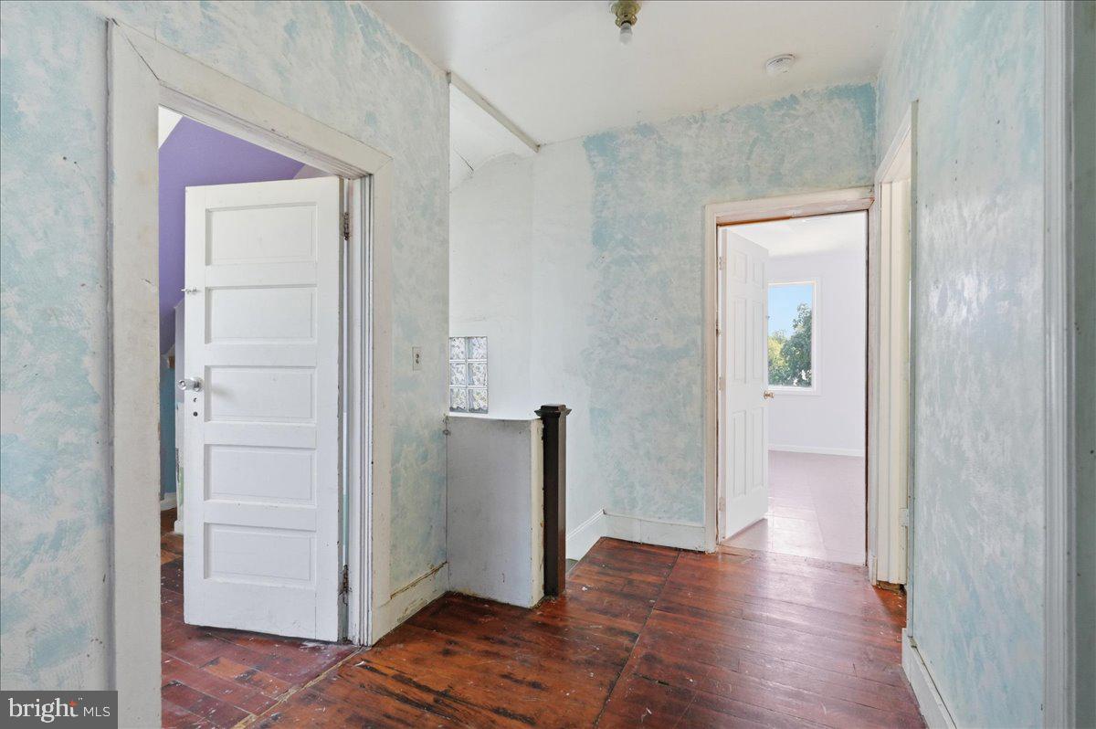 73 Church Road Arnold, MD 21012 - Photo 17 of 29 a view of a hallway with wooden floor