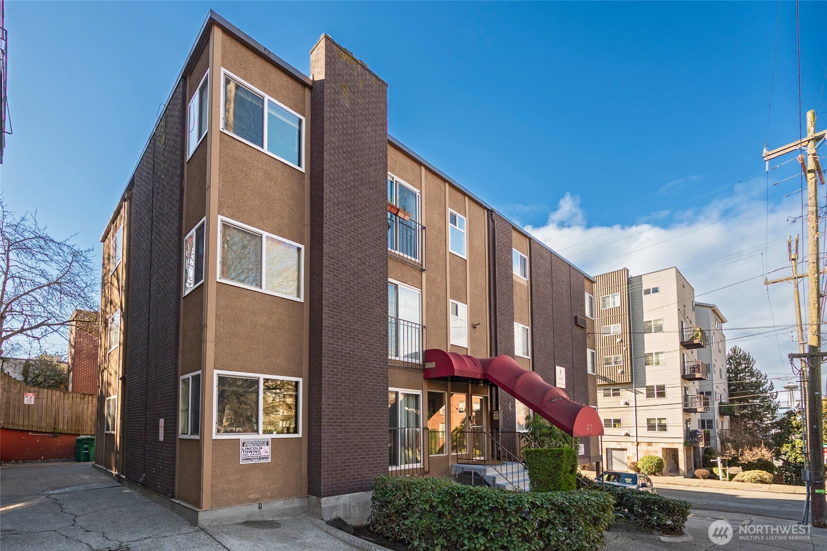 403 East Thomas Street, Unit 19 Seattle, WA 98102 - Photo 1 of 24 a front view of a building with glass windows
