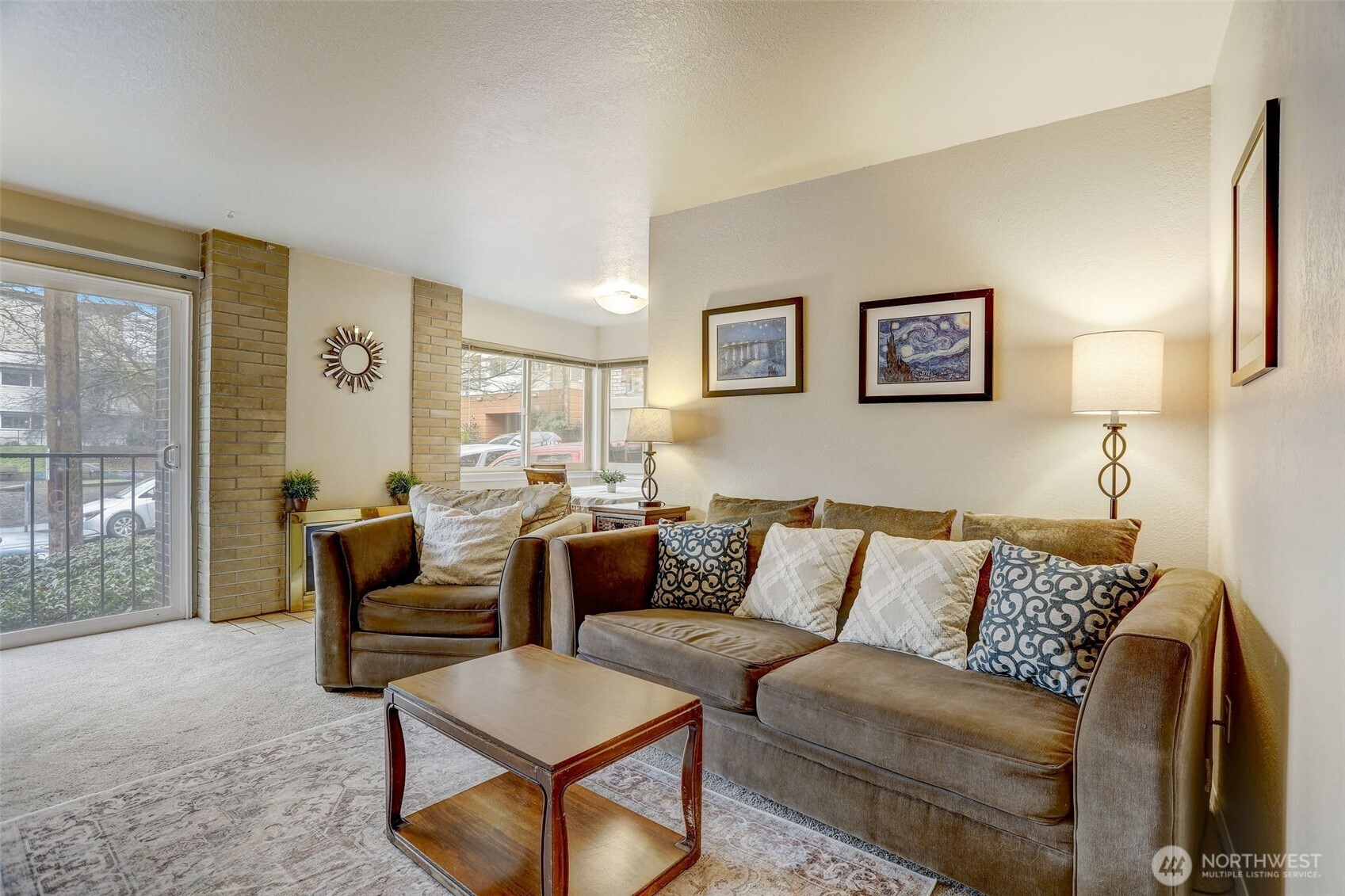 403 East Thomas Street, Unit 19 Seattle, WA 98102 - Photo 11 of 24 a living room with furniture and a large window