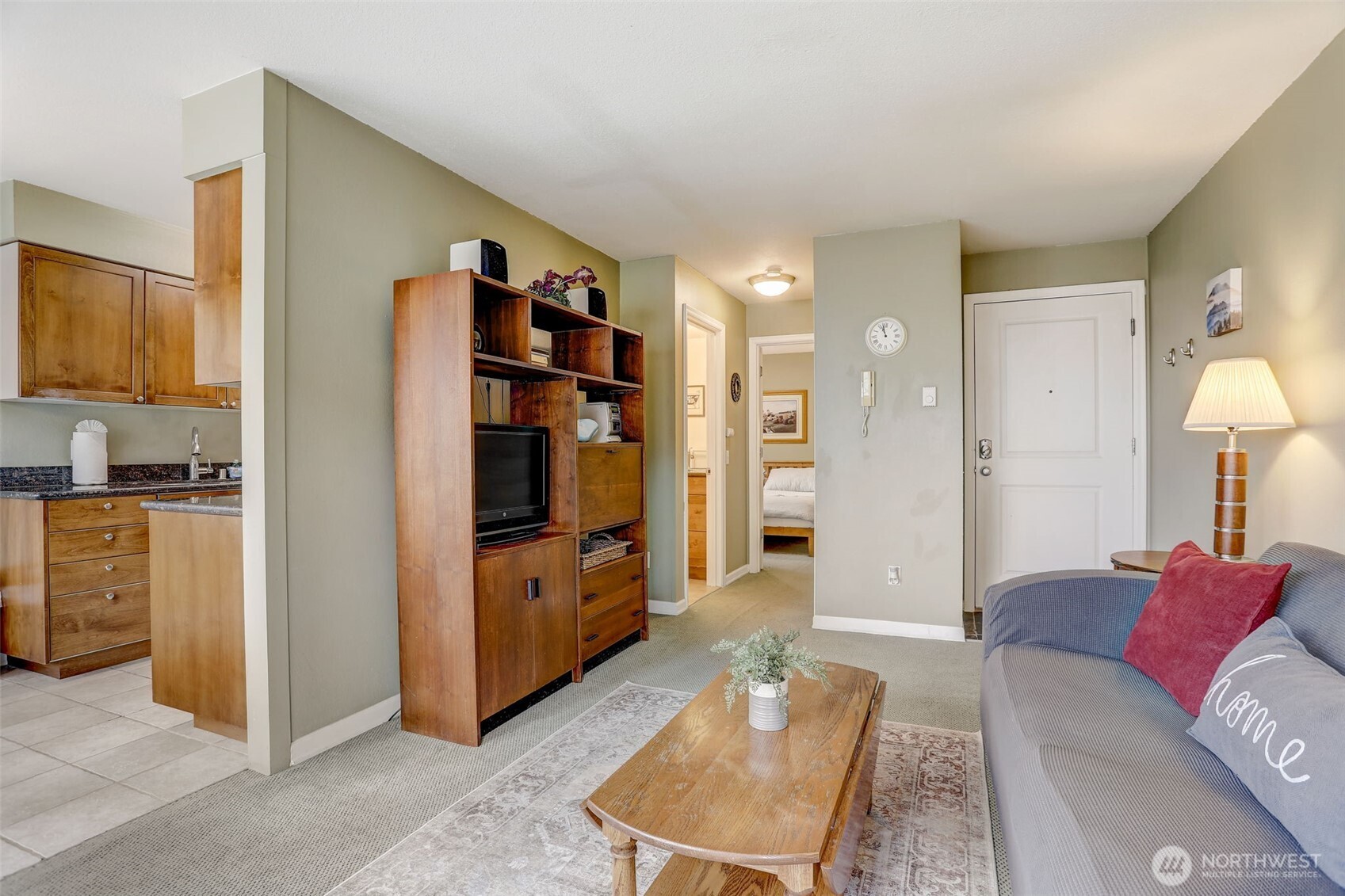 403 East Thomas Street, Unit 19 Seattle, WA 98102 - Photo 15 of 24 a living room with furniture and a flat screen tv