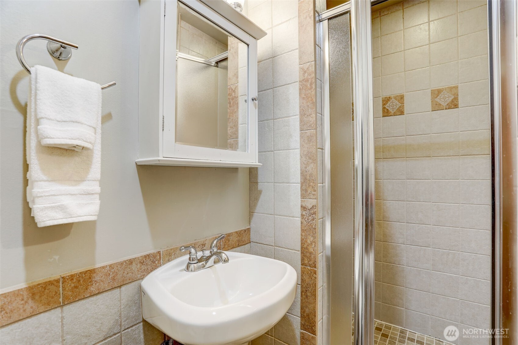 403 East Thomas Street, Unit 19 Seattle, WA 98102 - Photo 19 of 24 a bathroom with a sink and a mirror