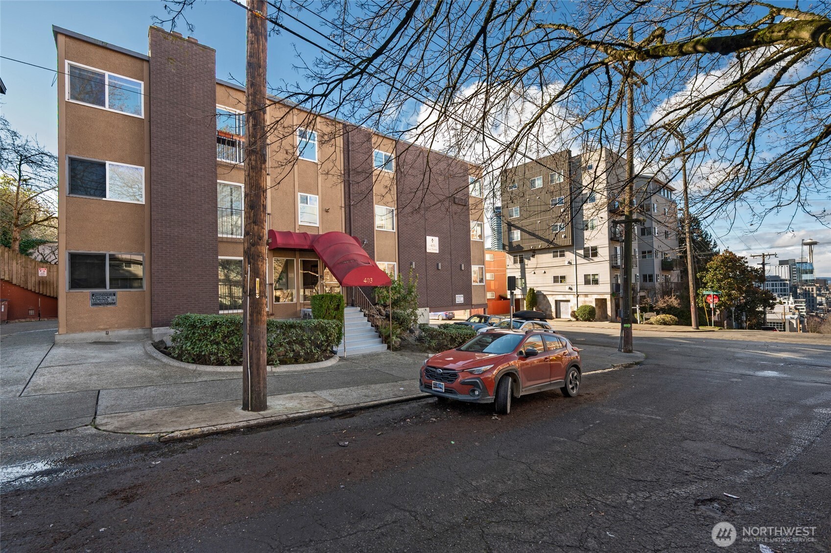 403 East Thomas Street, Unit 19 Seattle, WA 98102 - Photo 2 of 24 a car parked in front of a building