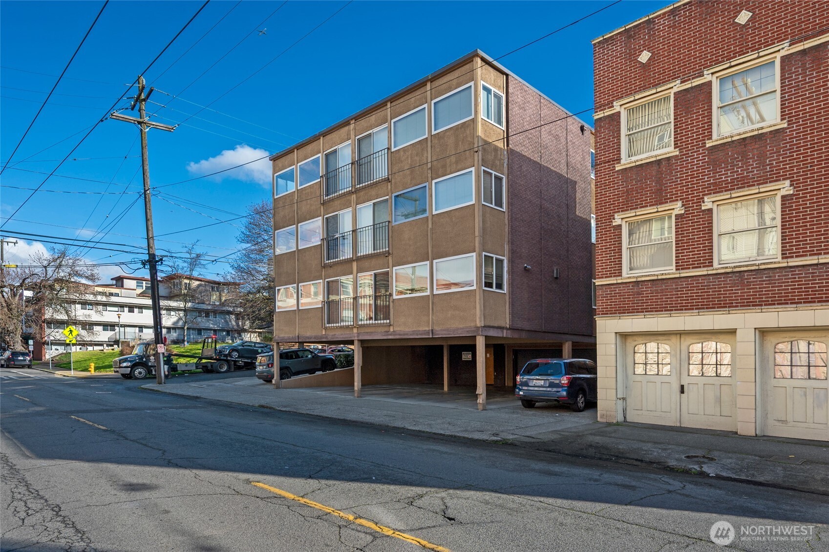 403 East Thomas Street, Unit 19 Seattle, WA 98102 - Photo 5 of 24 a city street lined with tall buildings