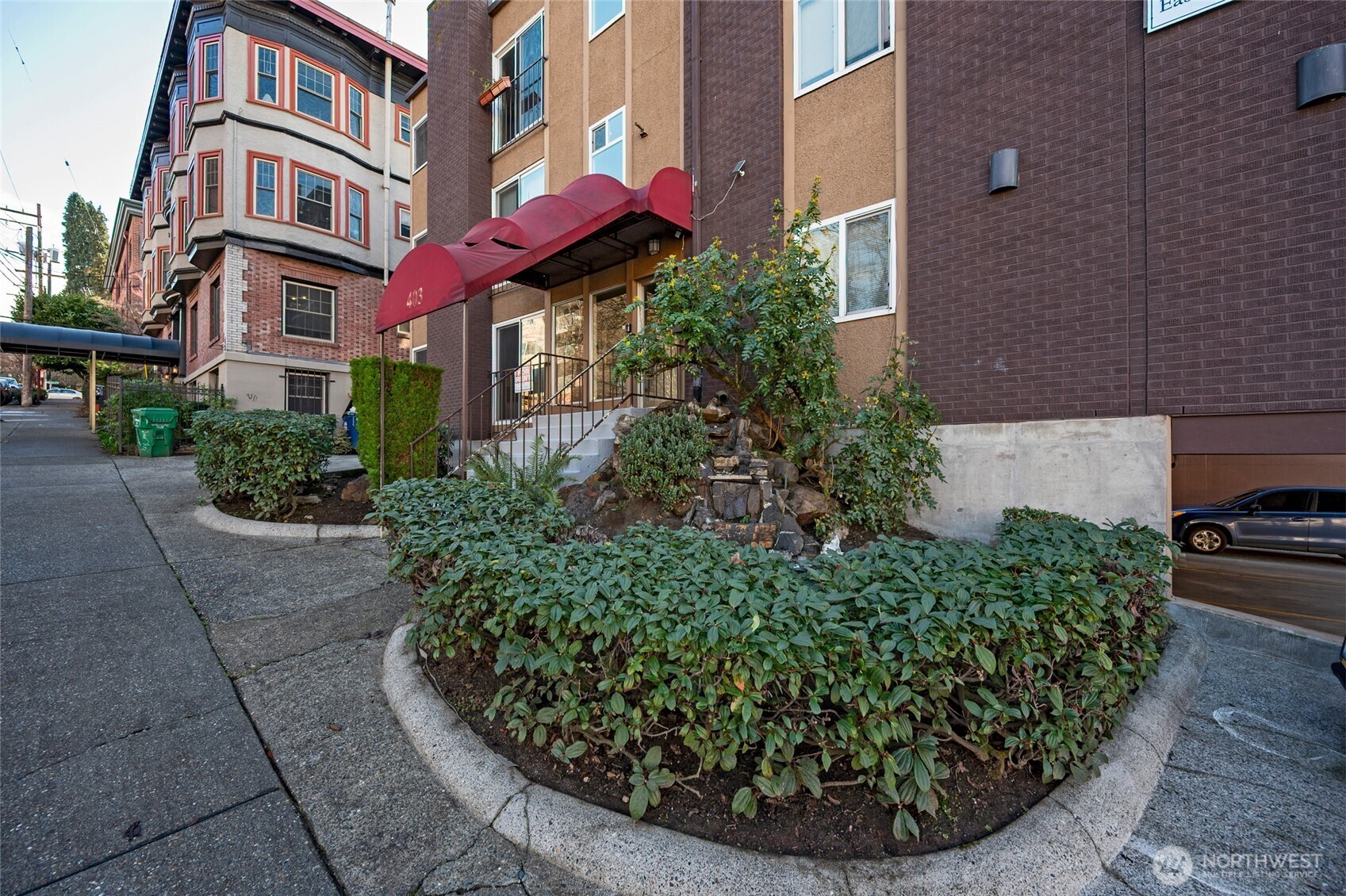 403 East Thomas Street, Unit 19 Seattle, WA 98102 - Photo 6 of 24 a view of a building with a yard