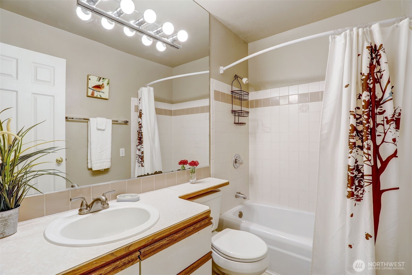 403 East Thomas Street, Unit 19 Seattle, WA 98102 - Photo 7 of 24 a bathroom with a sink a toilet a bathtub and shower