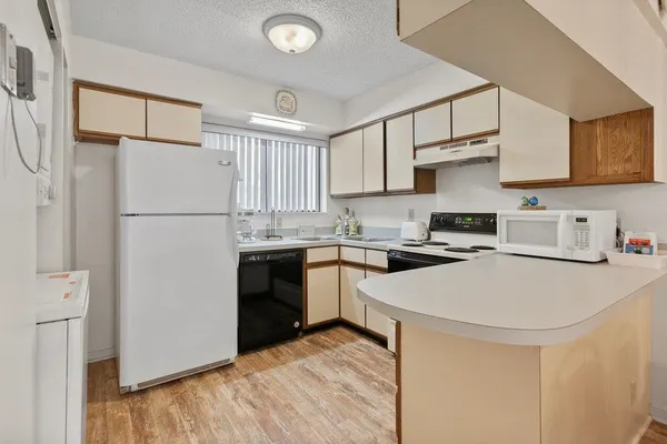 a kitchen with stainless steel appliances a refrigerator stove and sink