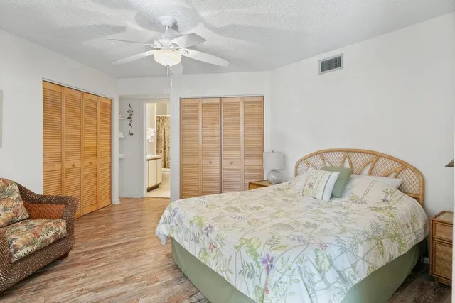 a bedroom with a large bed and a couch