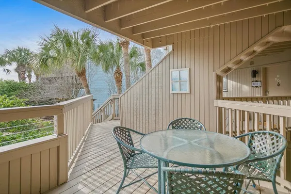 a view of a balcony and chairs