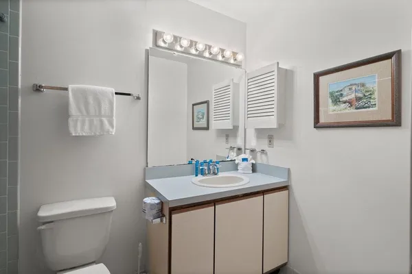 a living room with furniture a table and a chandelier